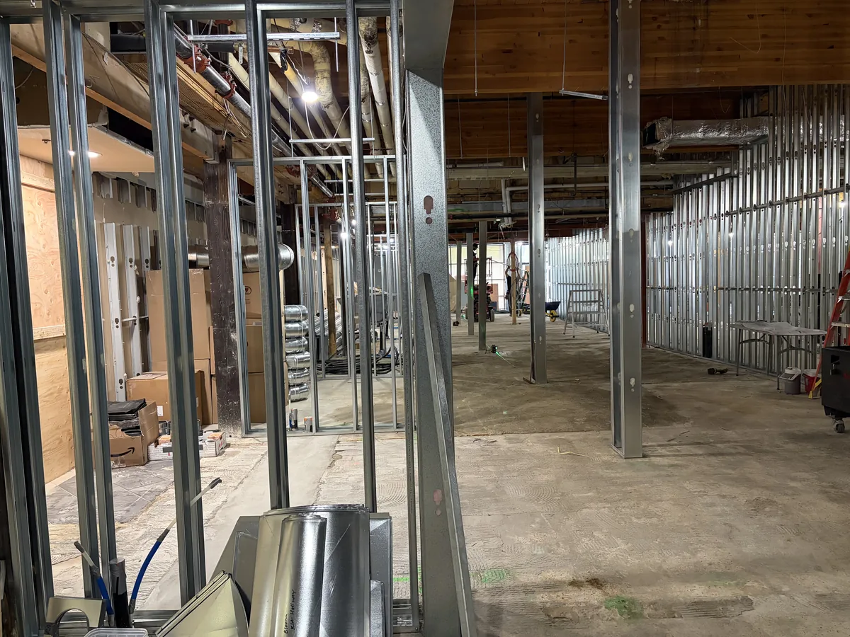 Construction at Bloom Kelowna: steel-framed studios along the main corridor